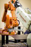 Robotic automation system with inspection tools, representing rising quoting activity in machine building.